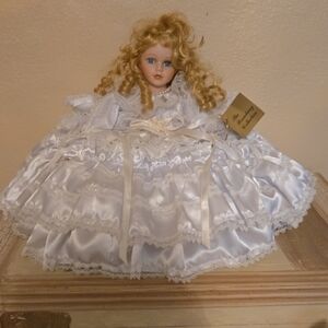 Elegant White Porcelain Doll with Curly Hair